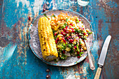 Quinoa salad with chickpeas, kale and corn on the cob