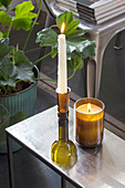 Candlestick and candle lantern made from cut-off wine bottles