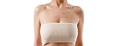 Woman's bandaged chest