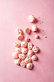 Pink and white meringue drops
