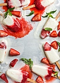 Strawberry yogurt ice cream popsicles with mint