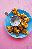 Caribbean pumpkin and sweetcorn fritters with a mint and yoghurt dip