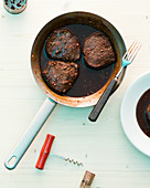 Beef fillet with a red wine sauce in a pan