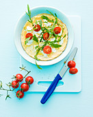 Goat's cheese omelette with cherry tomatoes and rocket