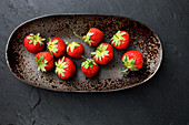 Strawberries in an oval dish (top view)