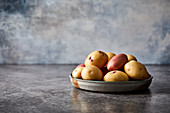 Various potatoes in a ceramic bowl