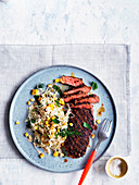 Smoky sirloin steaks with corn and cabbage slaw