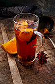 Spiced cider with an orange slice and star anise