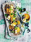 Spiced couscous with, oranges, blueberries and passionfruit yoghurt