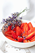 Strawberries with lavender syrup and lavender flowers