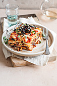 Aubergine lasagne with scamorza and spicy salami