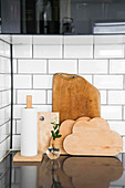 Cloud-shaped chopping boards and kitchen roll on simple holdeer
