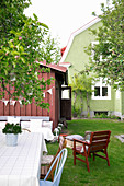 Seating area in Scandinavian summer garden of green house