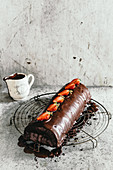 Saddle of venison wrapped in marzipan with chocolate glaze and strawberries