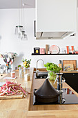 Elegant kitchen counter with wooden worksurface and integrated hob