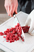 Beef being finely chopped