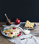 Thin crepes with fresh raspberry, cream and mint, 