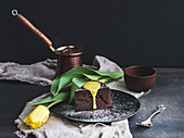Piece of truffle chocolate cake with lemon curd icing