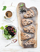 Fresh black-currant scones with coffee and bowl of berries