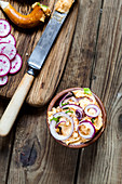 Obatzter (Bavarian Camembert cream) with onions, radishes and spring onions, pretzels