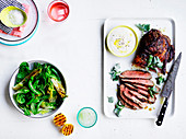 Barbecued butterflied lamb leg with saltbush rub - Charred lettuce and pea salad with lemon dressing