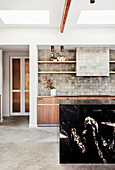 Black granite kitchen island in open living room