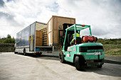 Loading crates into removals lorry