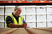 Worker in removals and storage facility