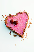 Cherry cream heart with chocolate sprinkles