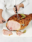 Cutting the glazed Christmas ham