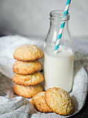 Lemon and coconut biscuits served with a bottle of milk