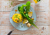 Vegetable quiche with a dandelion and artichoke heart salad