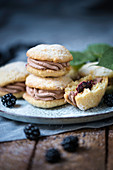 Vegan whoopie pies filled with blackberry sauce and chocolate cream