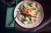 Wild alaskan salmon baked with shavings of fennel, fresh peas and potatoes