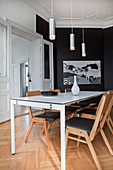 Elegant black-and-white dining room in period apartment