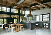 Open-plan, industrial-style interior with high ceiling