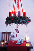 Suspended Advent wreath with red pillar candles