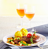 Venison steaks with potato towers, a bean medley and preserved pears