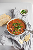 Vegan bean soup (red and white beans) made with vegetable stock, onion, tomatoes, jalapeno and chipotle