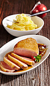 Roasted duck breast with a grape sauce and tagliatelle
