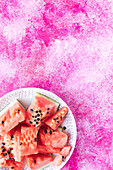 Watermelon slices on a white plate