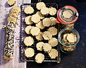 Sesame seed biscuits (baked and raw on a wire rack)