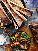Marrow bones, beef steak and vegetables