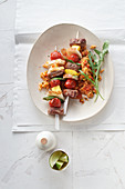 Spicy halloumi and lamb kebabs with Greek rice noodles