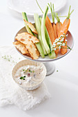 Sheep's cheese and olive dip with raw vegetables (cucumber, celery, carrots)