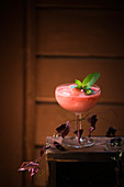 A frozen cocktail of watermelon, raspberries, gin and wine