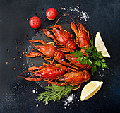 Boiled cooked crayfish crawfish ready to eat on white cutting board