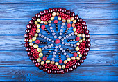 Art food mandala in hape of cirkle of assorted fruits and berries