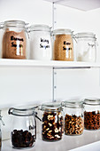 Hand-labelled storage jars of sugar and dried fruits