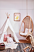 Play wigwam and hanging chair in child's bedroom
